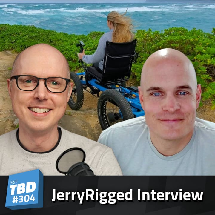 Matt Ferrell and Zach Nelson in front of someone in a wheelchair on a hilly path